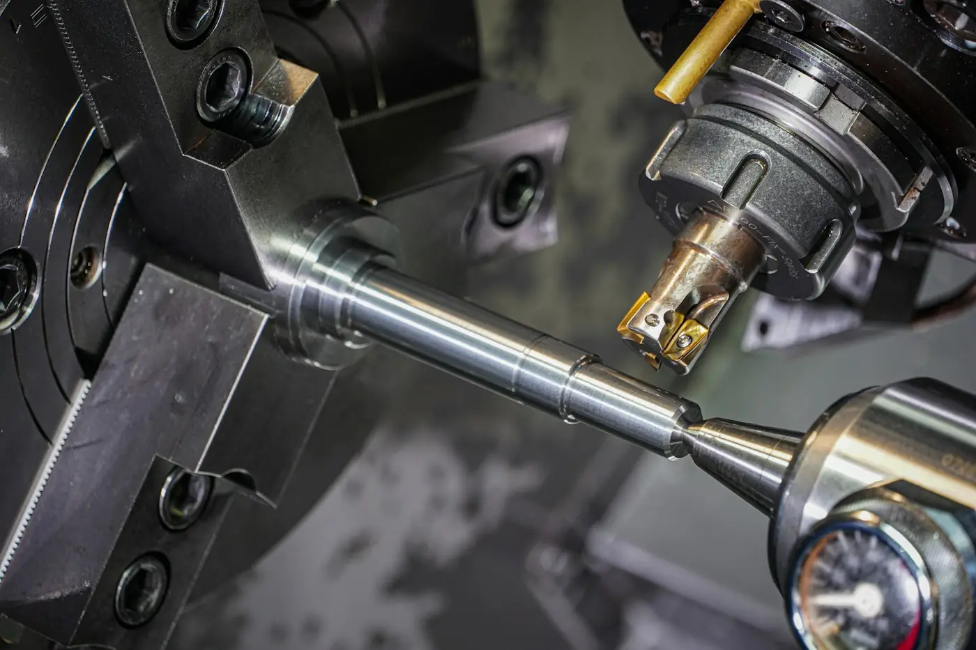 Metal rod being machined on a lathe